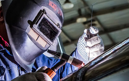 Person Welding With Mask On