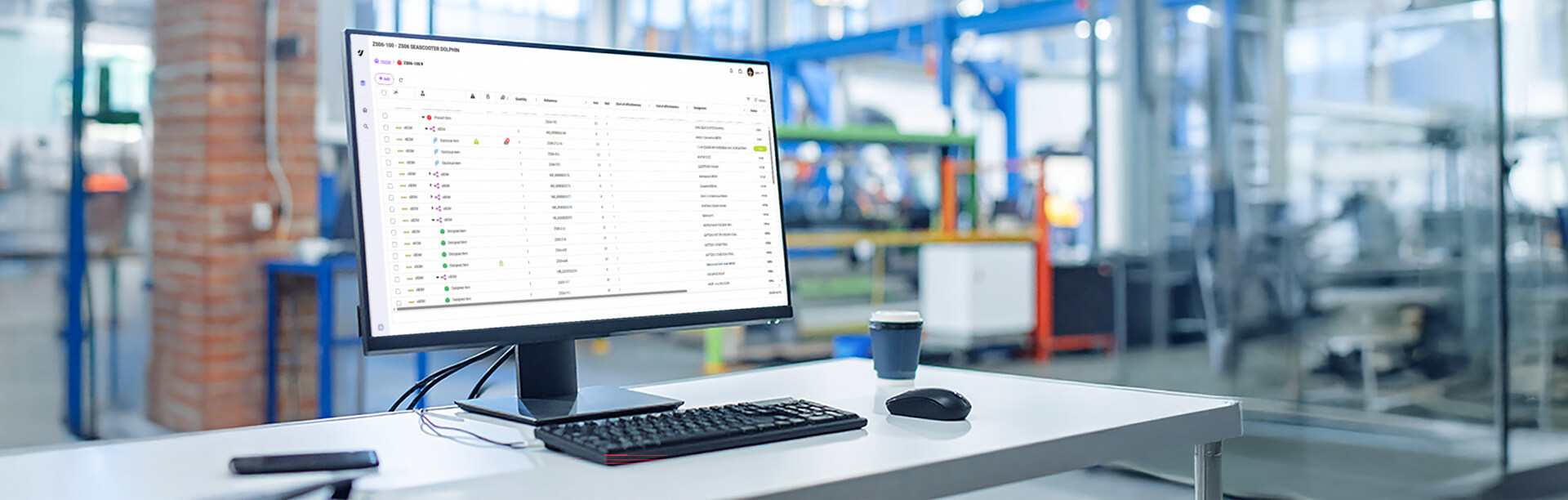 An image of a computer in a factory with a bill of materials on the screen