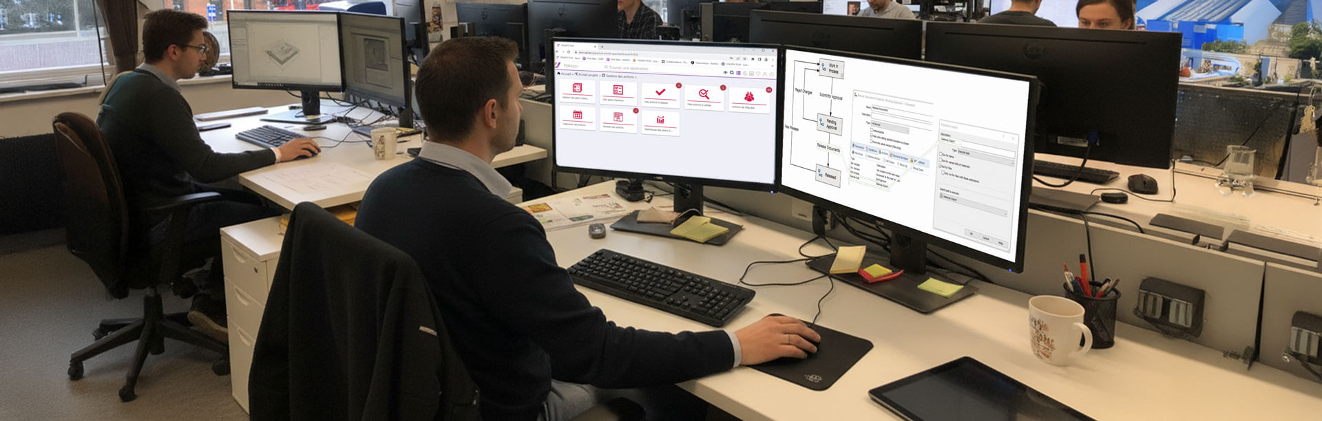 A person using Visiativ PLM on a desktop in an office