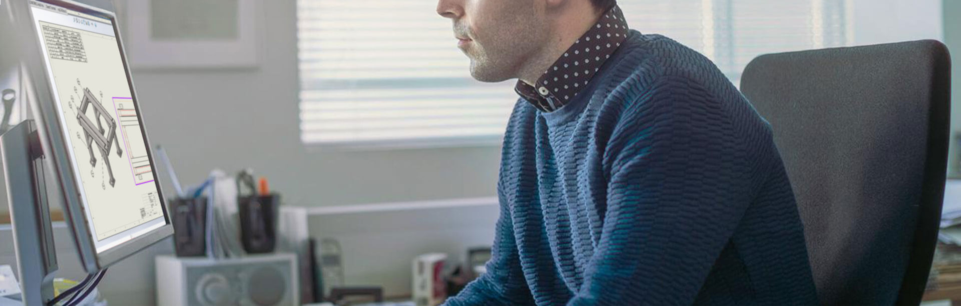 A picture of someone using SOLIDWORKS on a computer