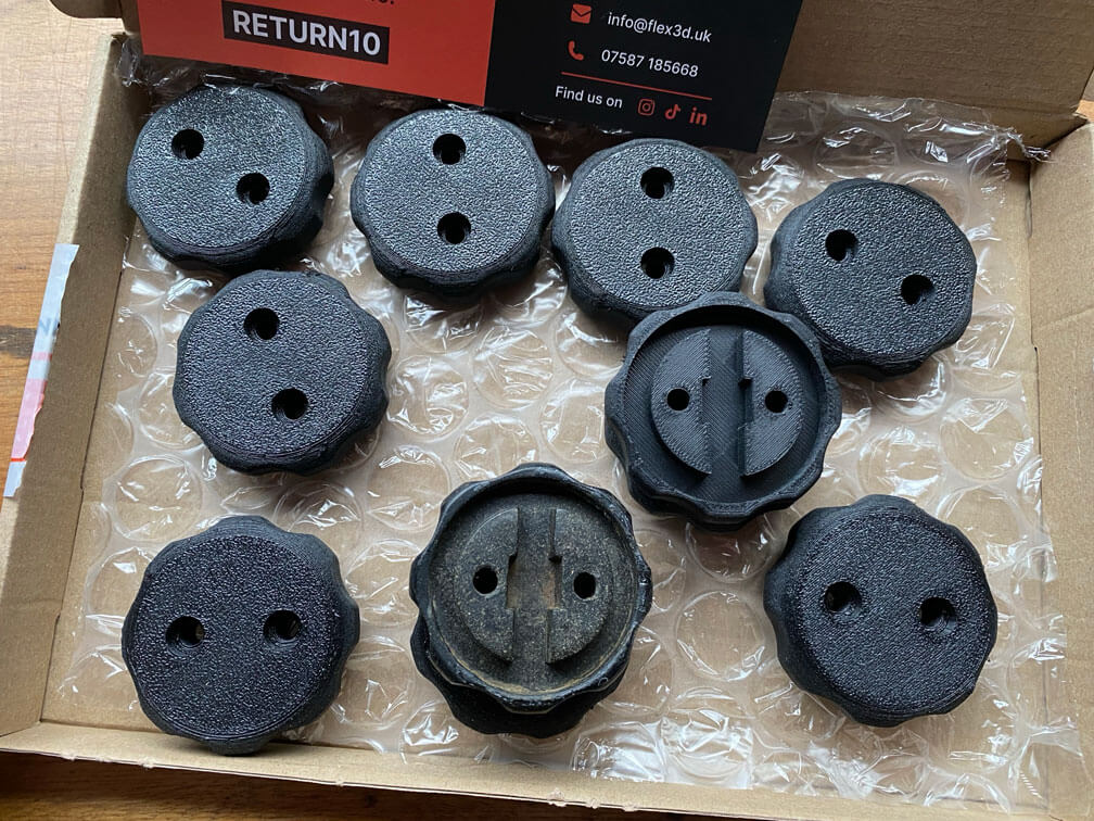 A photo of an original part and a new replacement part that was designed in SOLIDWORKS