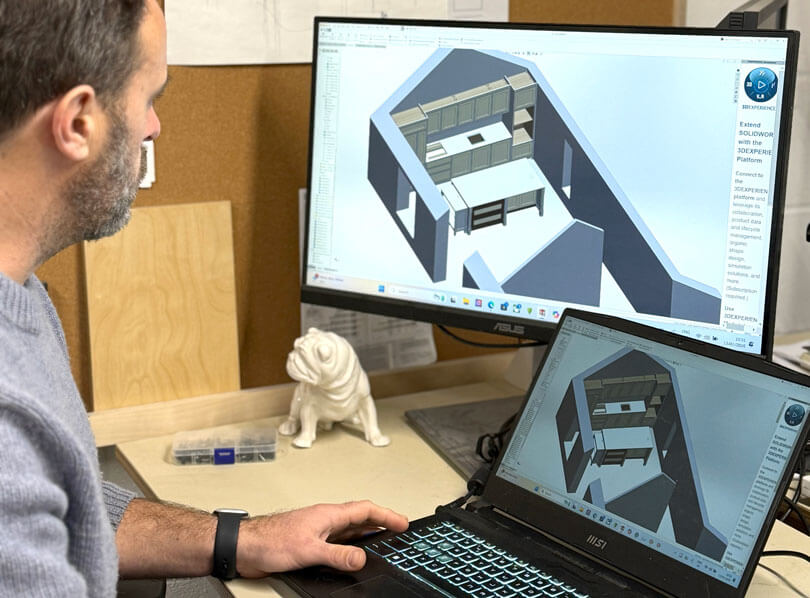 Schoolhouse Workshops' Founder, Andrew, working on a CAD model of a kitchen