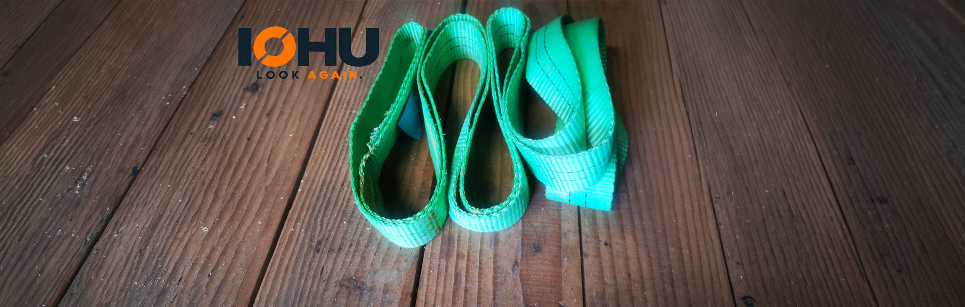 A banner image of floorboards with construction straps and the IoHu logo